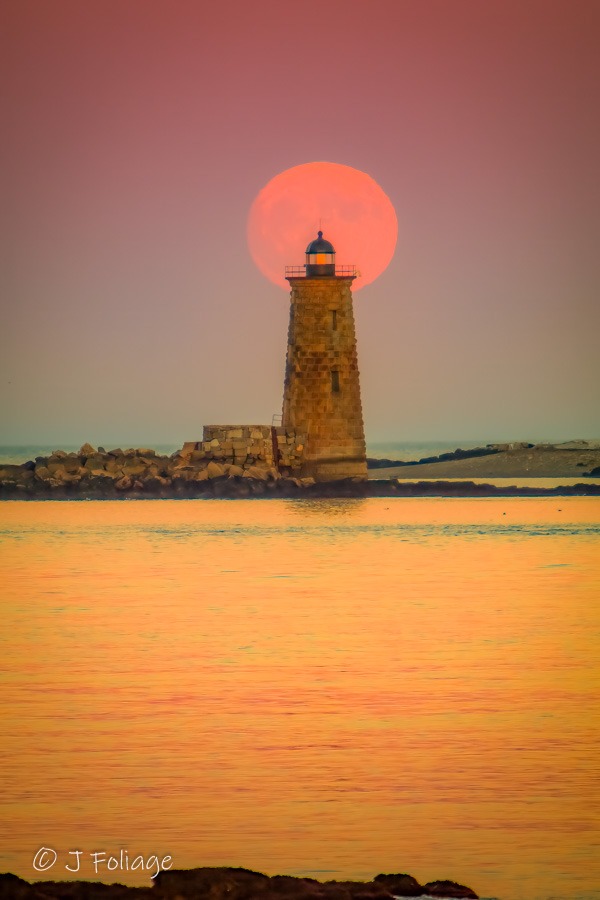 Whaleback lighthouse with a full supermoon