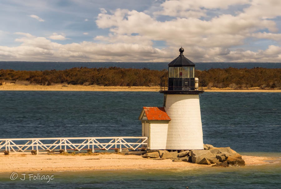 View of Brant Point Lighthouse from the ferry approaching Nantucket Harbor.