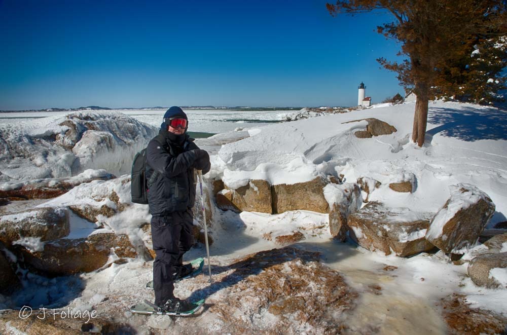 Photographer wearing layers of fleece a balaclava and wind-stop clothing for subzero winter photography