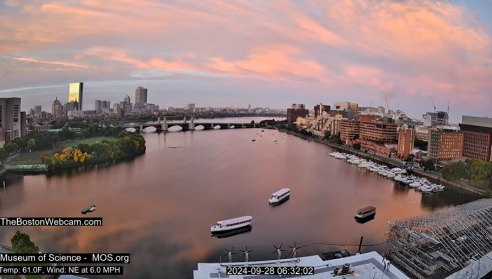 Dawn bathes Boston in pink and gold hues