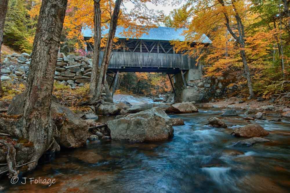 Franconia Notch State Park is located in between the between the high peaks of the Kinsman and Franconia mountain ranges.