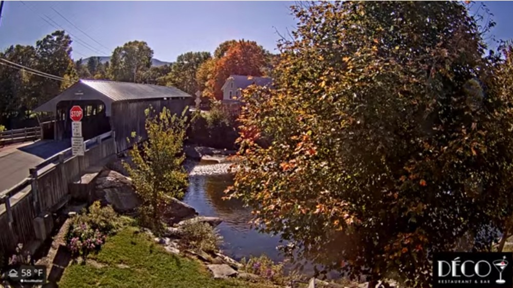 The fall colors begin to arrive at the Waitsfield Vermont covered bridge