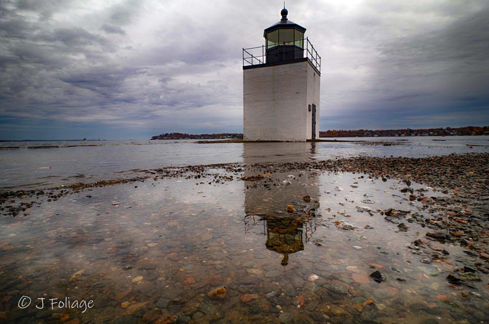 A King high tide brings the ocean up to the base of the Derby Wharf Lighthouse